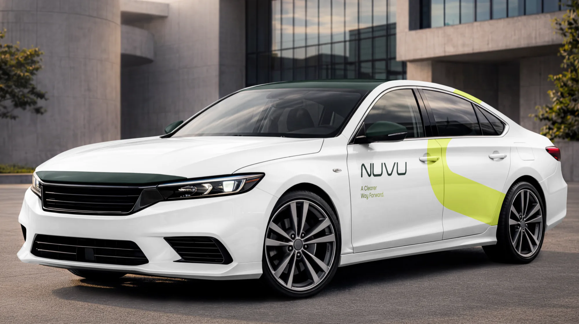 A white car in NuVu livery, the citrus curve running along the flank