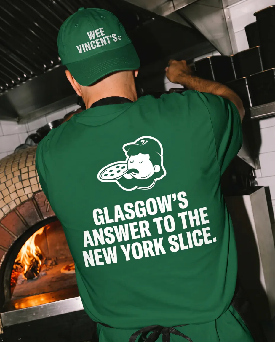 Staff tee and cap in green, the mascot and the line printed on the back